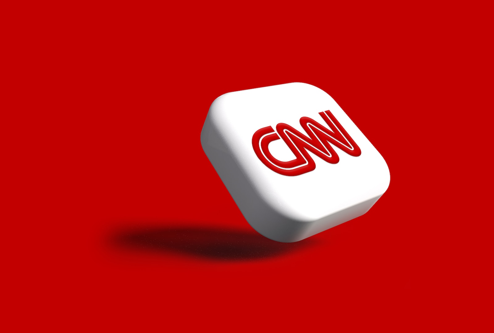 a white dice with the word cnn on it