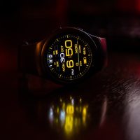 round black digital watch at 6:50