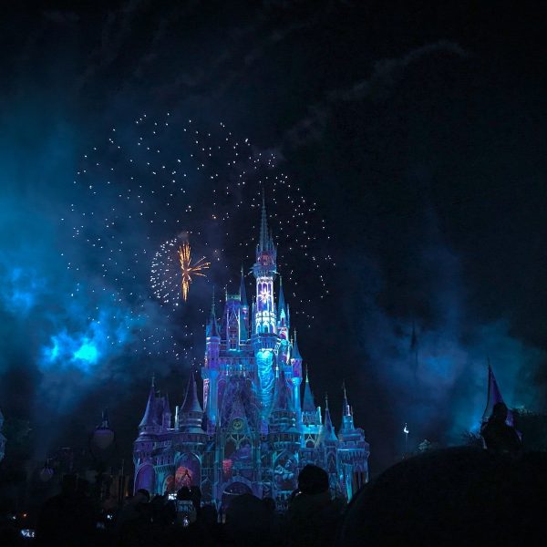 disney crystal castle with fireworks at night